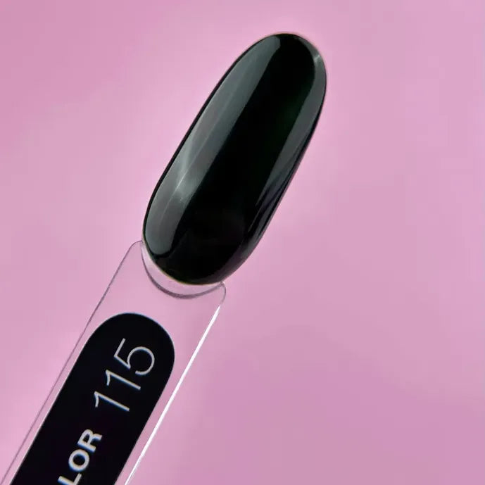 Black gel nail polish swatch labeled 115 on a clear stick, pink background