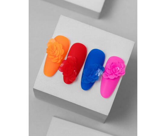 Colorful artificial nails with 3D floral designs in orange, red, blue, and pink, displayed on a white block, manicure accessories.